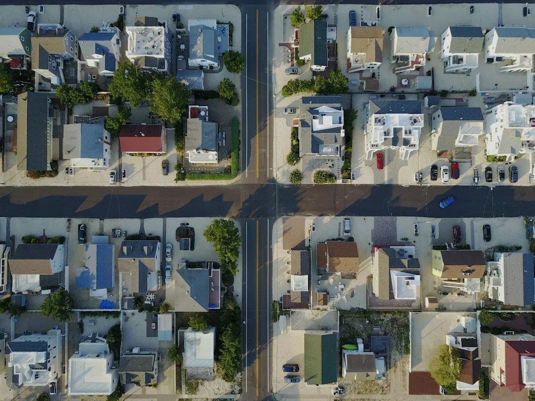 Overhead aerial of a dense residential neighborhood and its streets