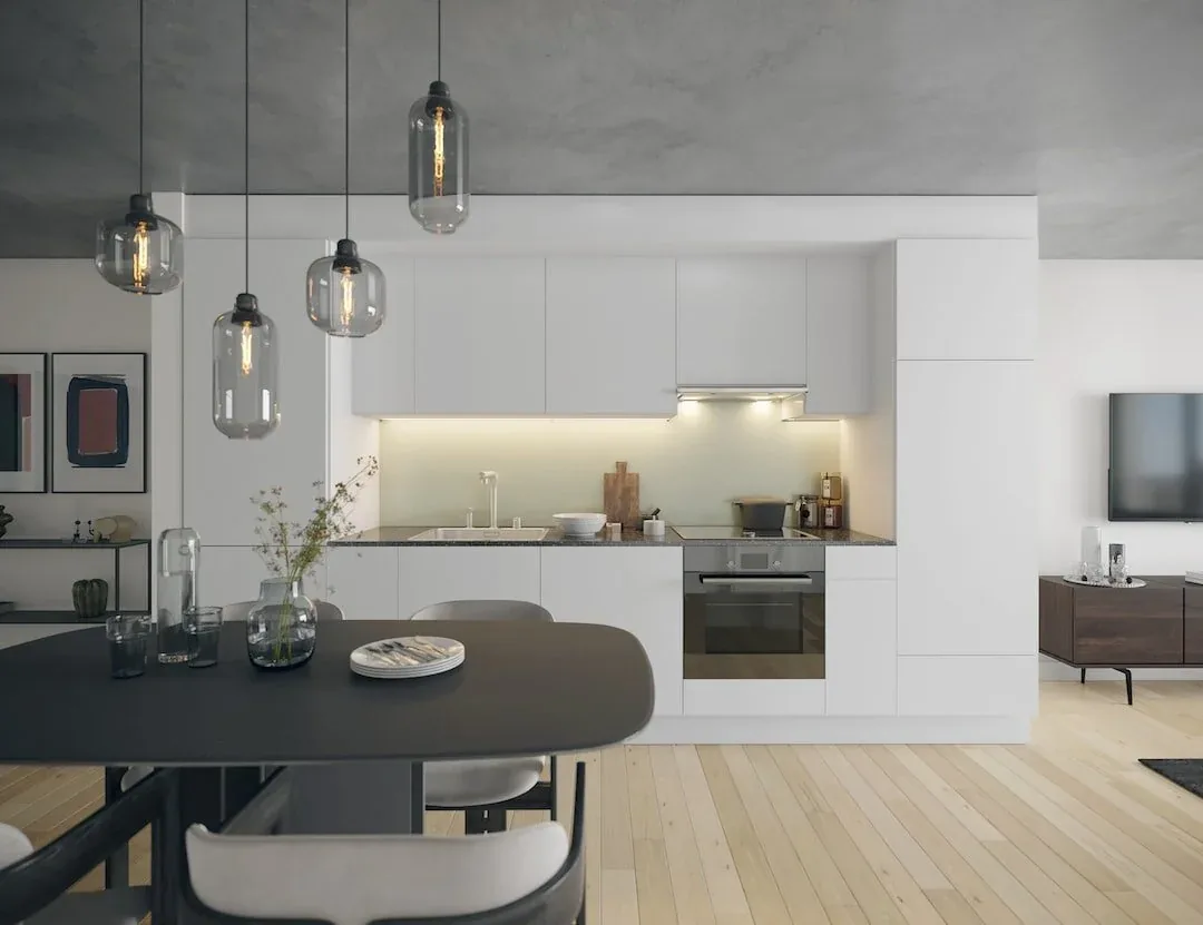 Modern grey and white kitchen with an adjoining dining nook